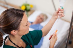a nurse prepares an IV