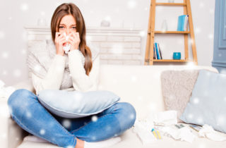 Young woman with allergies in her living room