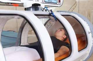 female patient in hyperbaric oxygen therapy chamber