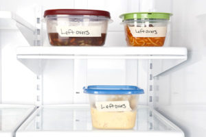 Leftover food containers in refrigerator