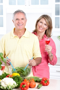 Couple in Kitchen with Healthy fruit salad