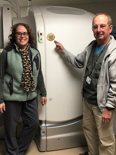 Melissa Dettore (left) and Zenon Bursztynsky (right), Nuclear Medicine Technologists at OSF Saint Elizabeth Medical Center, celebrating the ACR Accreditation in Nuclear Medicine.